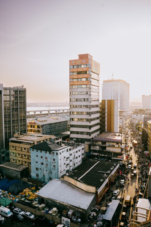 Free Highrise buildings and busy streets in Lagos, Nigeria, captured at sunset, showcasing urban life. Stock Photo