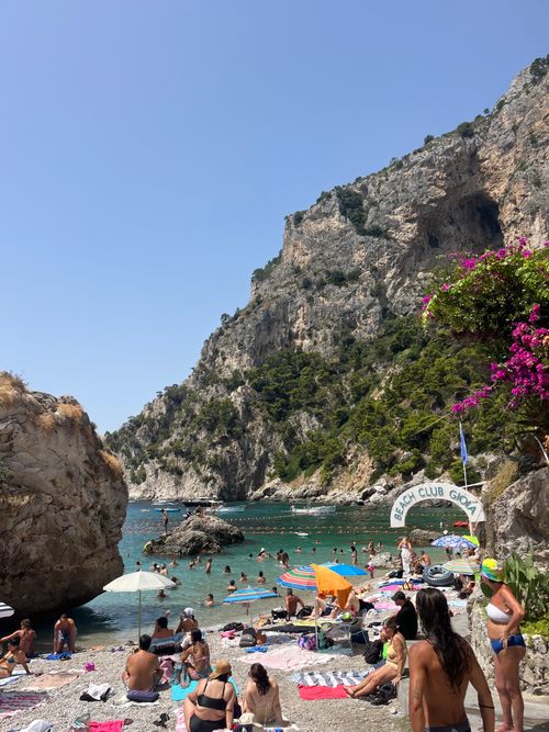 Free Enjoy a vibrant summer day at the picturesque beach of Marina di Praia, Italy. Stock Photo