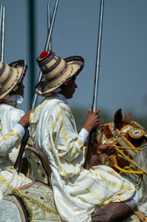 Free Horsemen in traditional attire during a Moroccan cultural festival in Rabat. Stock Photo