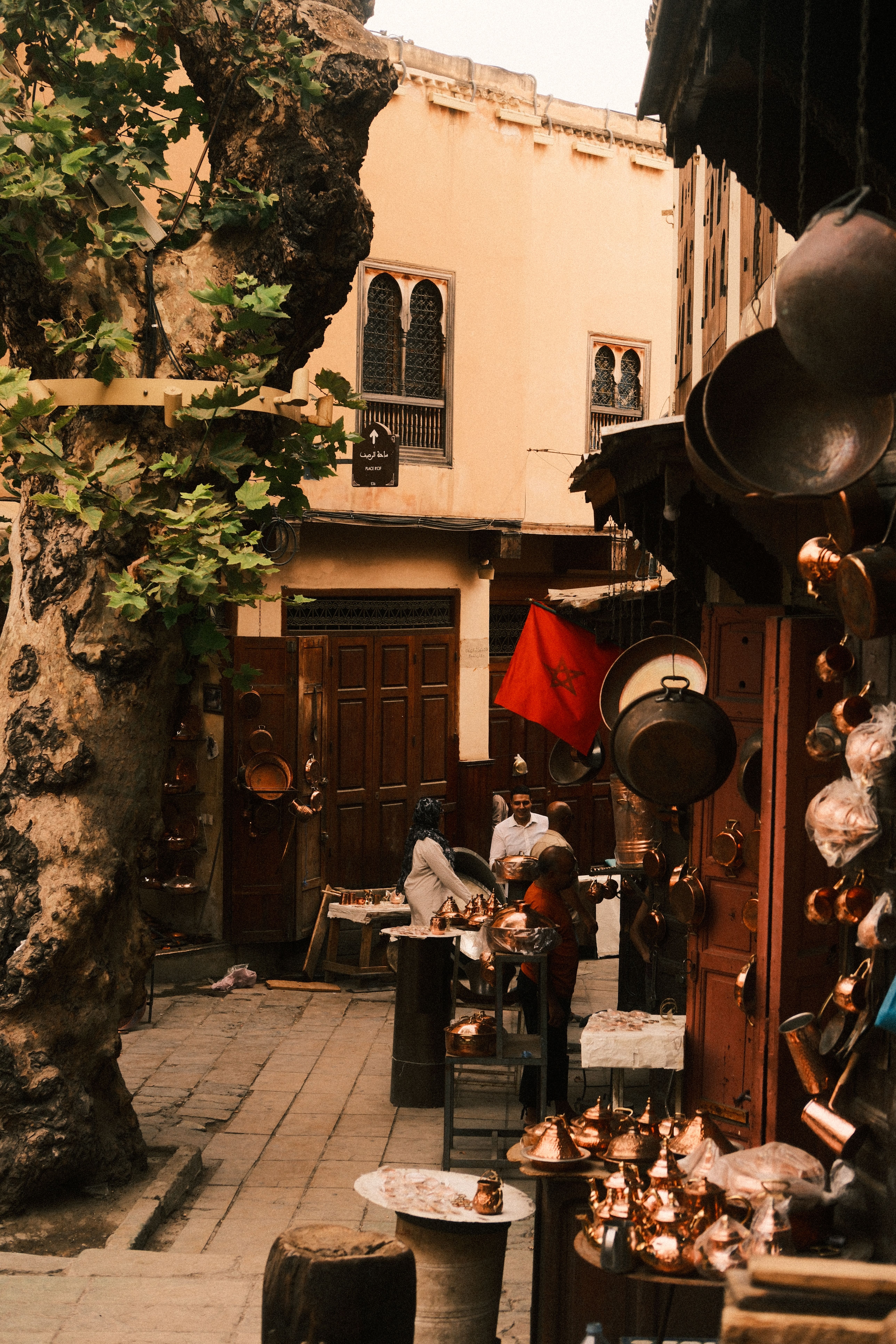 Scene of copper goods stalls in the historic medina of Fes, Morocco.