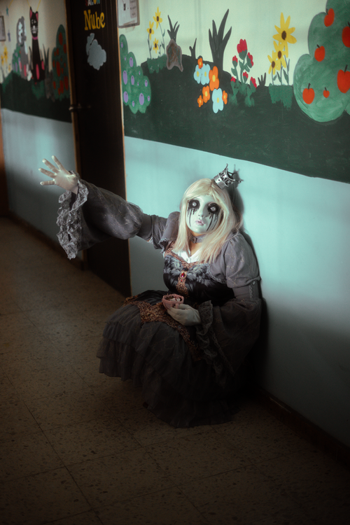 Free A haunting gothic cosplay scene with a porcelain mask and victorian dress in Mexico City. Stock Photo
