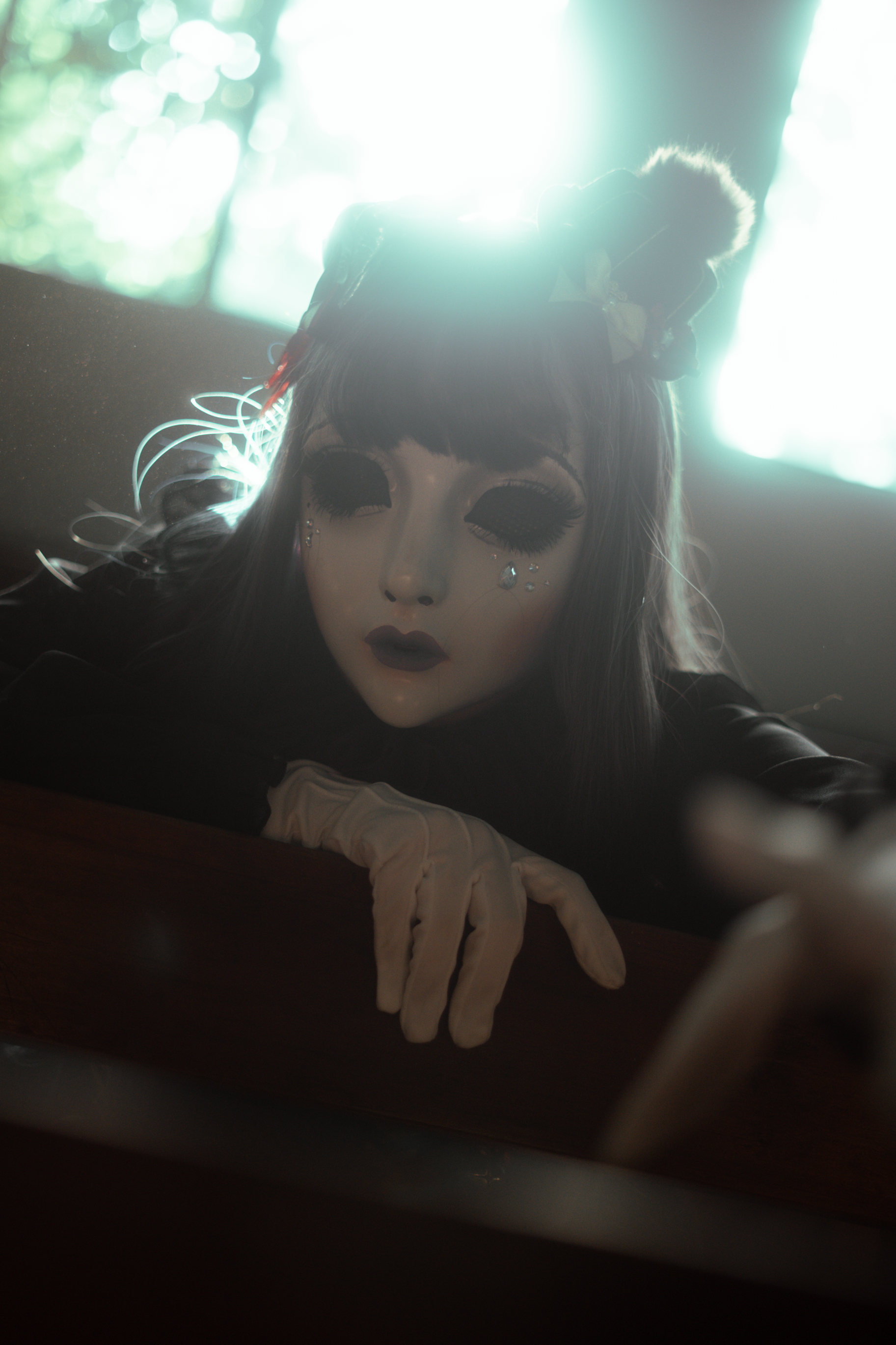 Eerie portrait of a figure in gothic fashion wearing a porcelain mask, exuding a dark fantasy vibe.