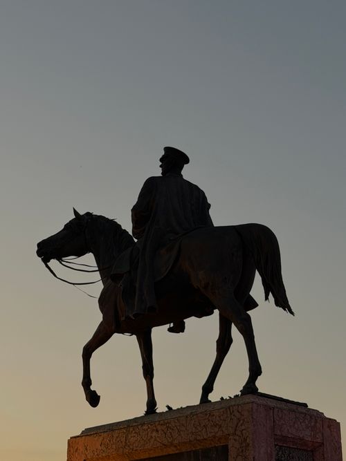 Free Majestic equestrian statue silhouetted against a stunning sunset, capturing Ankara's historical essence. Stock Photo