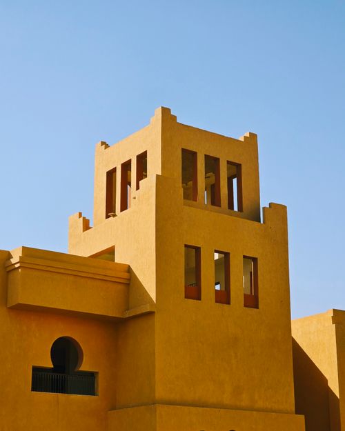 Free A stunning display of traditional Egyptian architecture with a clear blue sky backdrop, capturing its unique aesthetic. Stock Photo