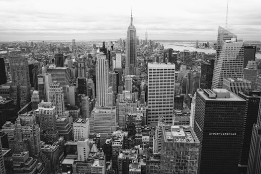Classic black and white view of New York City's skyline featuring skyscrapers and urban architecture.