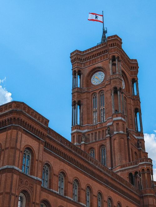 Free Rotes Rathaus in Berlin, Germany, iconic red brick architecture against a clear blue sky. Stock Photo