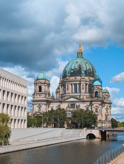 Free View of Berlin Cathedral by the Spree River on a sunny day with clouds. Stock Photo