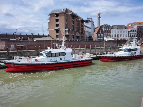 View of pilot boats docked in the Vlissingen harbor, showcasing the city's maritime charm.