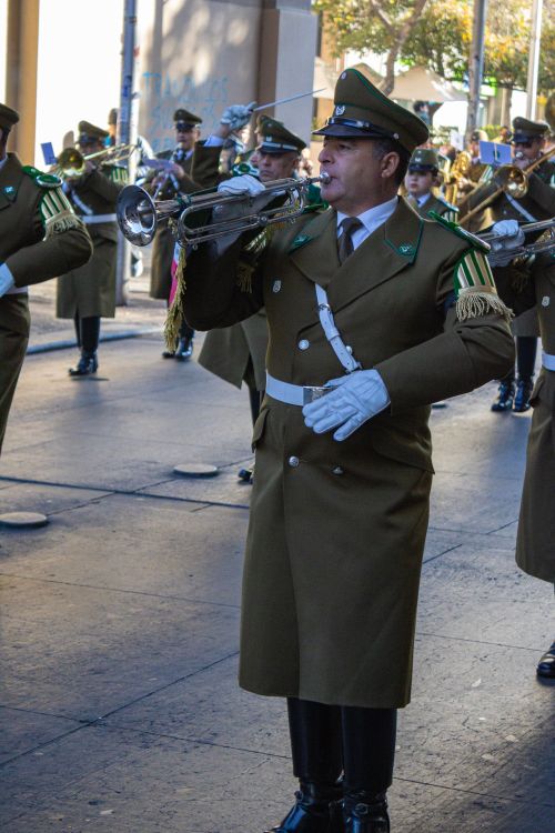 Free Military musicians in uniform perform during a parade in Santiago, Chile, showcasing ceremonial precision and discipline. Stock Photo