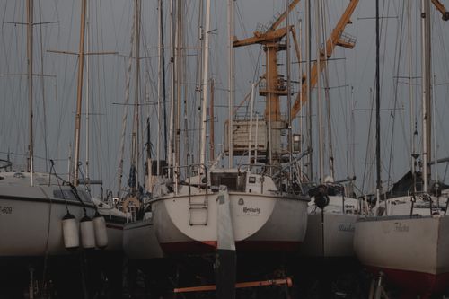 Free Sailboats moored in a shipyard in Tallinn, Estonia, during twilight. Stock Photo