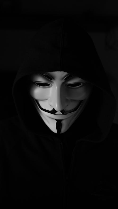 Free Portrait Photography of a Person Wearing Guy Fawkes Mask Stock Photo