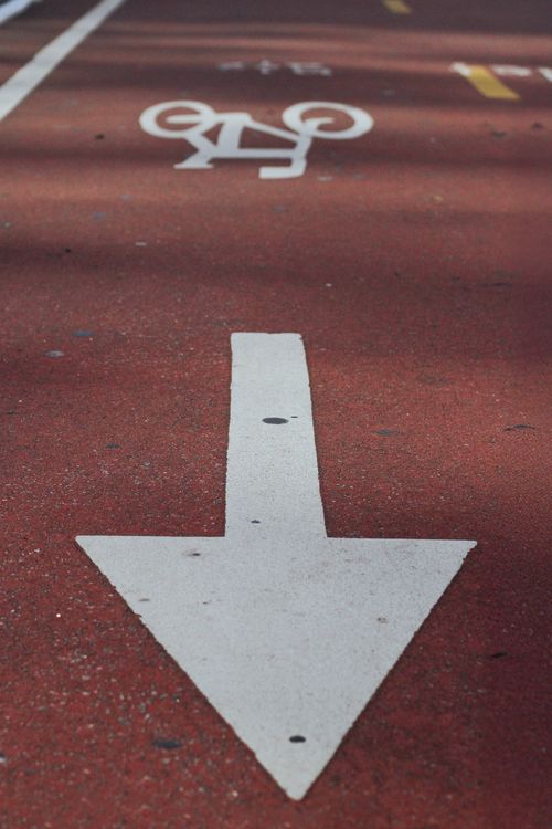 Free Bicycle path with clear directional arrows on a sunny day in São Paulo, Brazil. Stock Photo