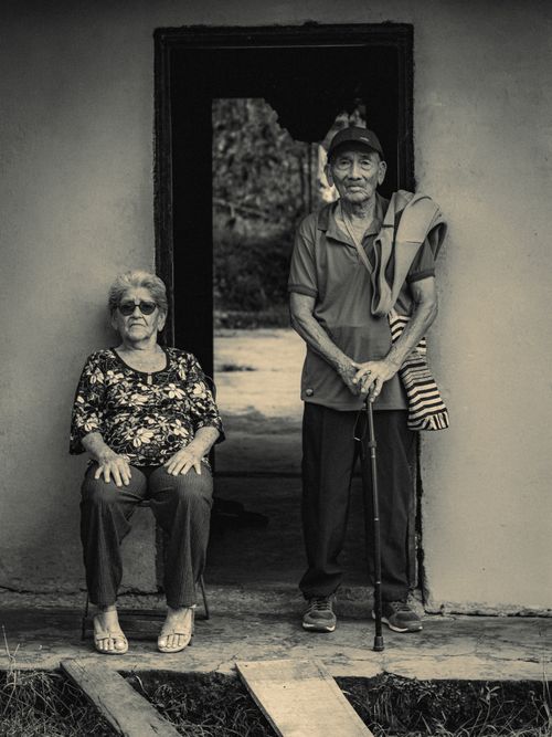 Free A serene portrait of a senior couple relaxing outside their home in Gigante, Huila, Colombia. Stock Photo