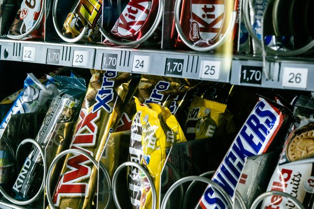 Chocolate bars and confectionery stocked in vending machine coils