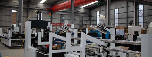Interior view of a modern industrial manufacturing facility with machinery and equipment.