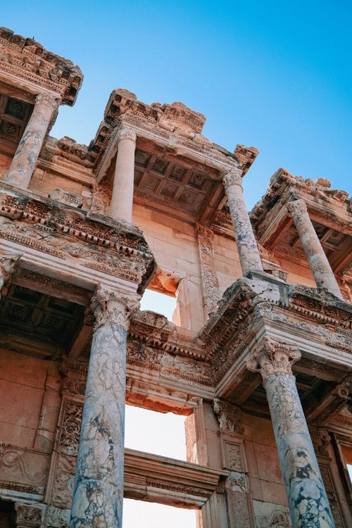 Free The ancient marble columns of the Celsus Library in Ephesus, Turkey, stand under a clear blue sky. Stock Photo