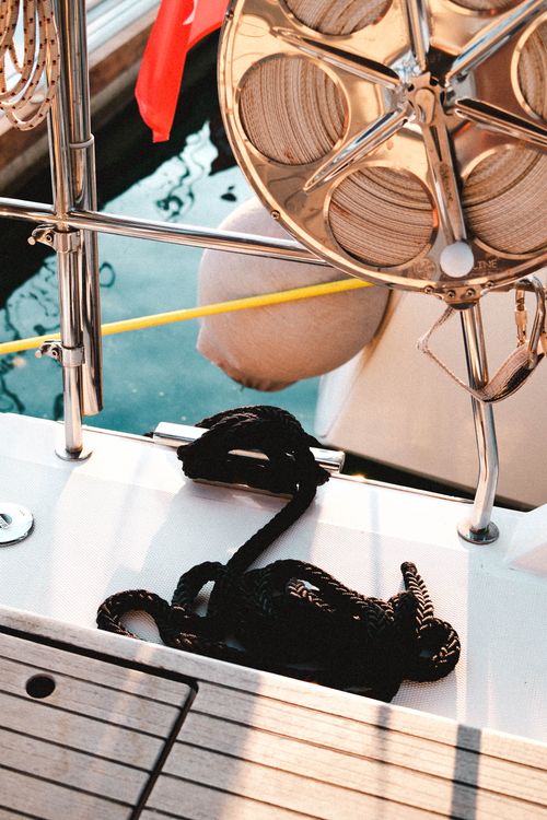 Free Rope and winch on a sailboat in Sığacık marina, sunlit nautic detail. Stock Photo