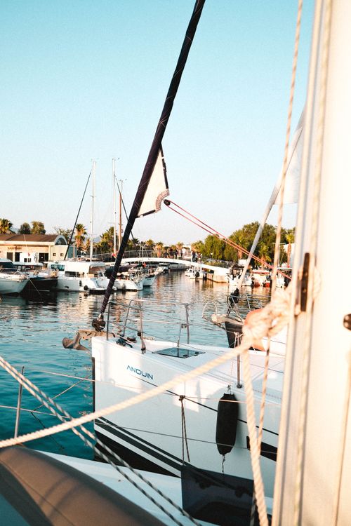 Free A peaceful view of sailboats docked at Sığacık Marina, capturing the serene ambiance. Stock Photo