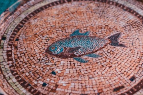 Free Beautiful ancient fish mosaic found in Sığacık, İzmir, showcasing detailed artistry. Stock Photo
