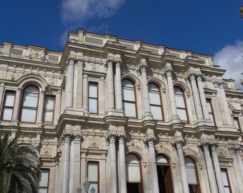 Free Historic neoclassical architecture with columns against a clear blue sky. Stock Photo