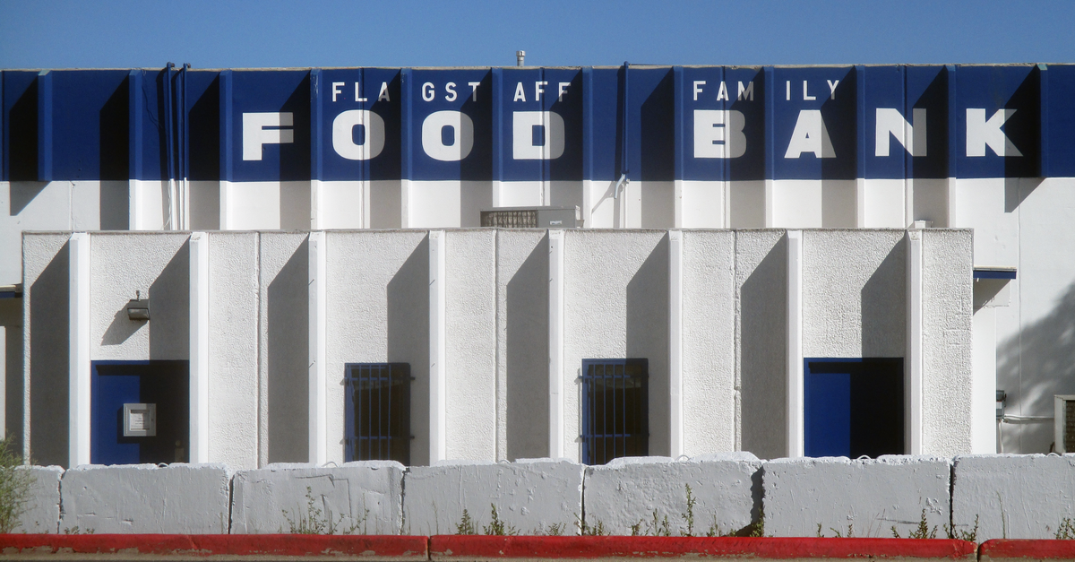Modern food bank building exterior with bold blue and white design in Flagstaff.