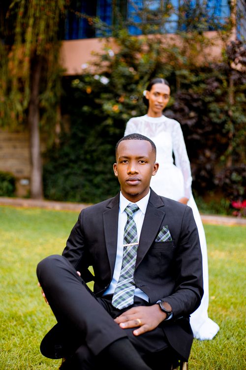 Free Stylish couple in formal attire posing outdoors on their wedding day. Stock Photo