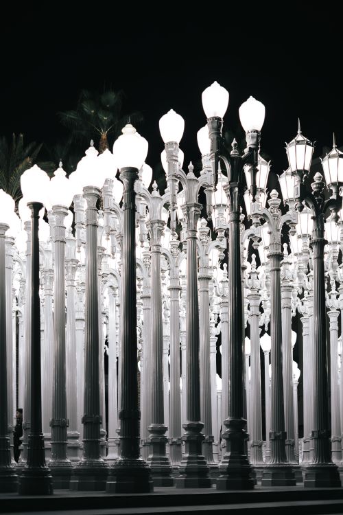 Free Iconic Urban Light installation at LACMA, featuring illuminated vintage street lamps at night. Stock Photo