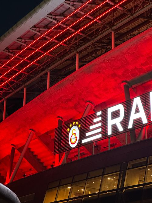 Free Illuminated red stadium exterior at night in Istanbul, Türkiye. Stock Photo
