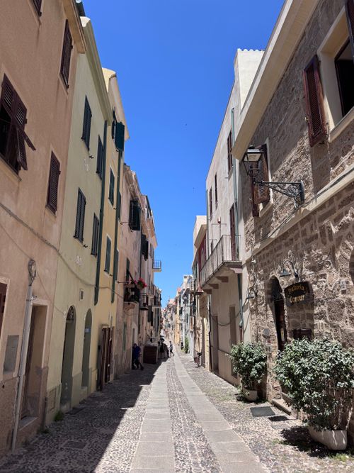 Free Explore the picturesque narrow street with historic architecture in Alghero, Sardinia, Italy. Stock Photo
