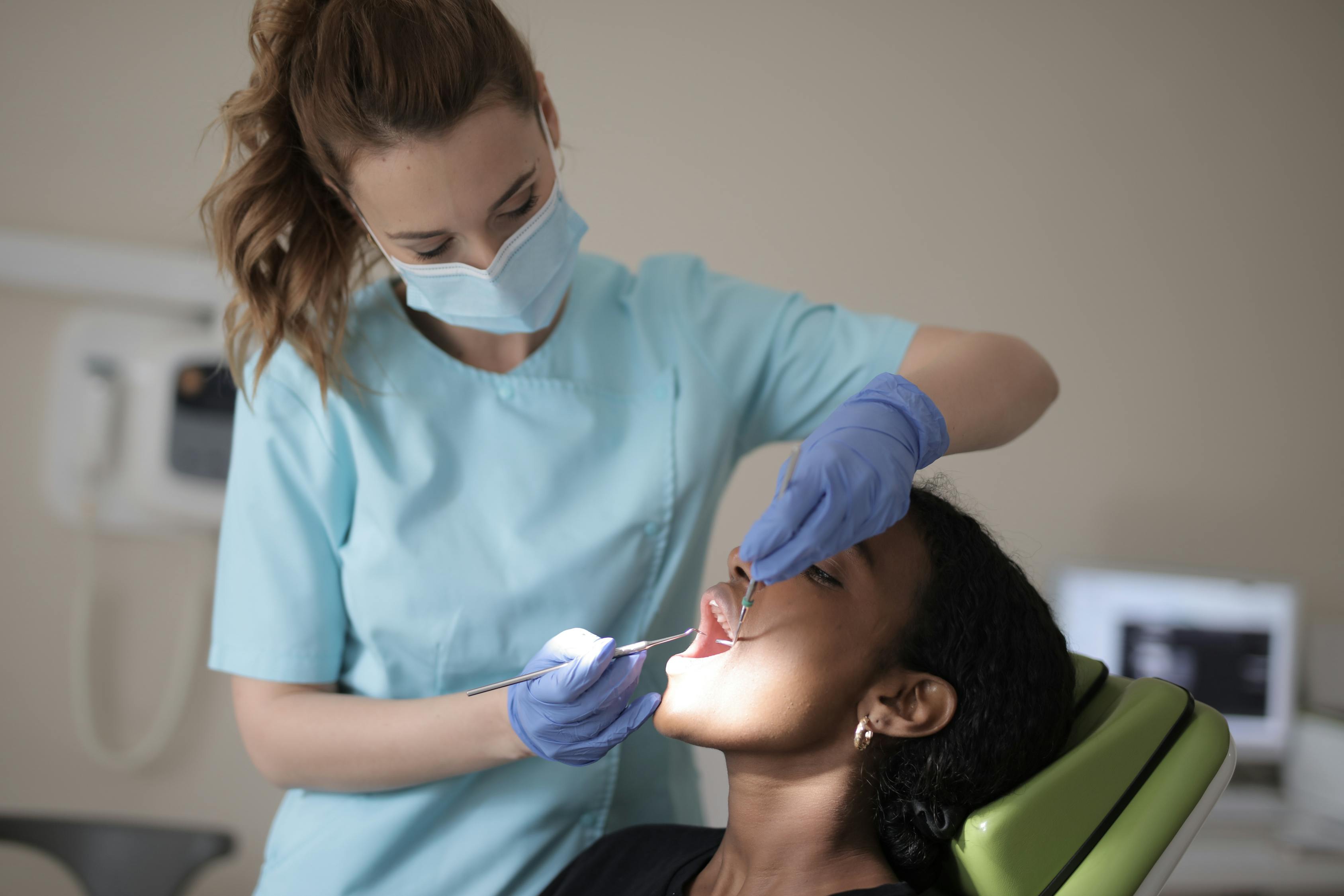 A Dentist Checking On Her Patient Free Stock Photo A Dentist Checking On Her Patient Free Stock Photo