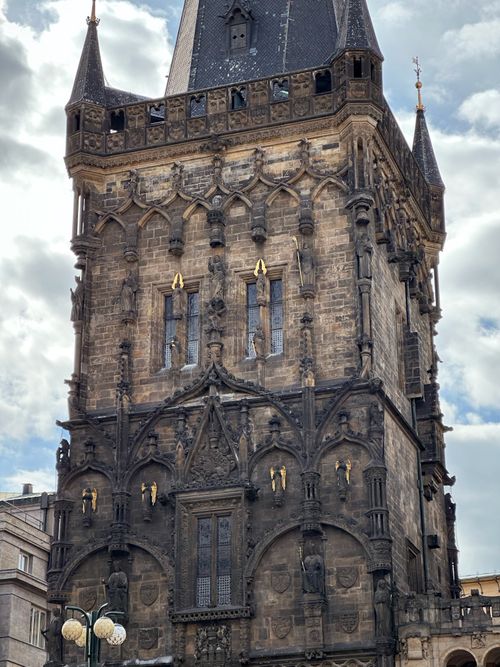 Free Close-up view of the historic Gothic Powder Tower, Prague, with cloudy sky backdrop. Stock Photo