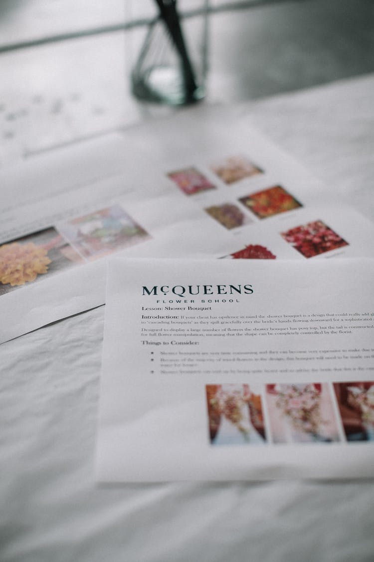 Bridal Flowers Pictures On Table In Light Workplace