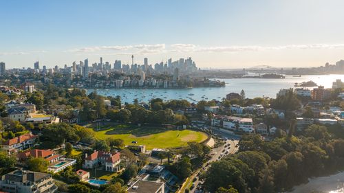 Free A captivating aerial shot of Sydney skyline with the iconic Harbour Bridge at sunset. Stock Photo