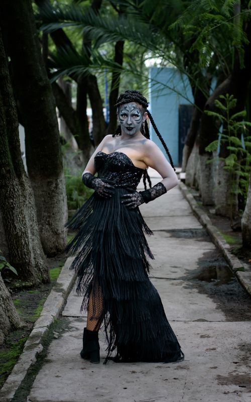 Free Striking portrait of a person in a creative costume on a lush forest path. Stock Photo