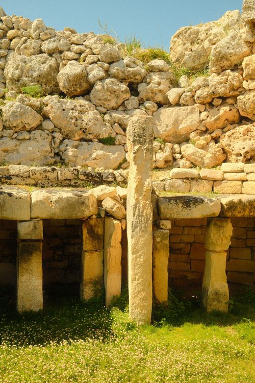 Free Explore ancient stone temple ruins with unique architecture in a vibrant, sunny landscape. Stock Photo