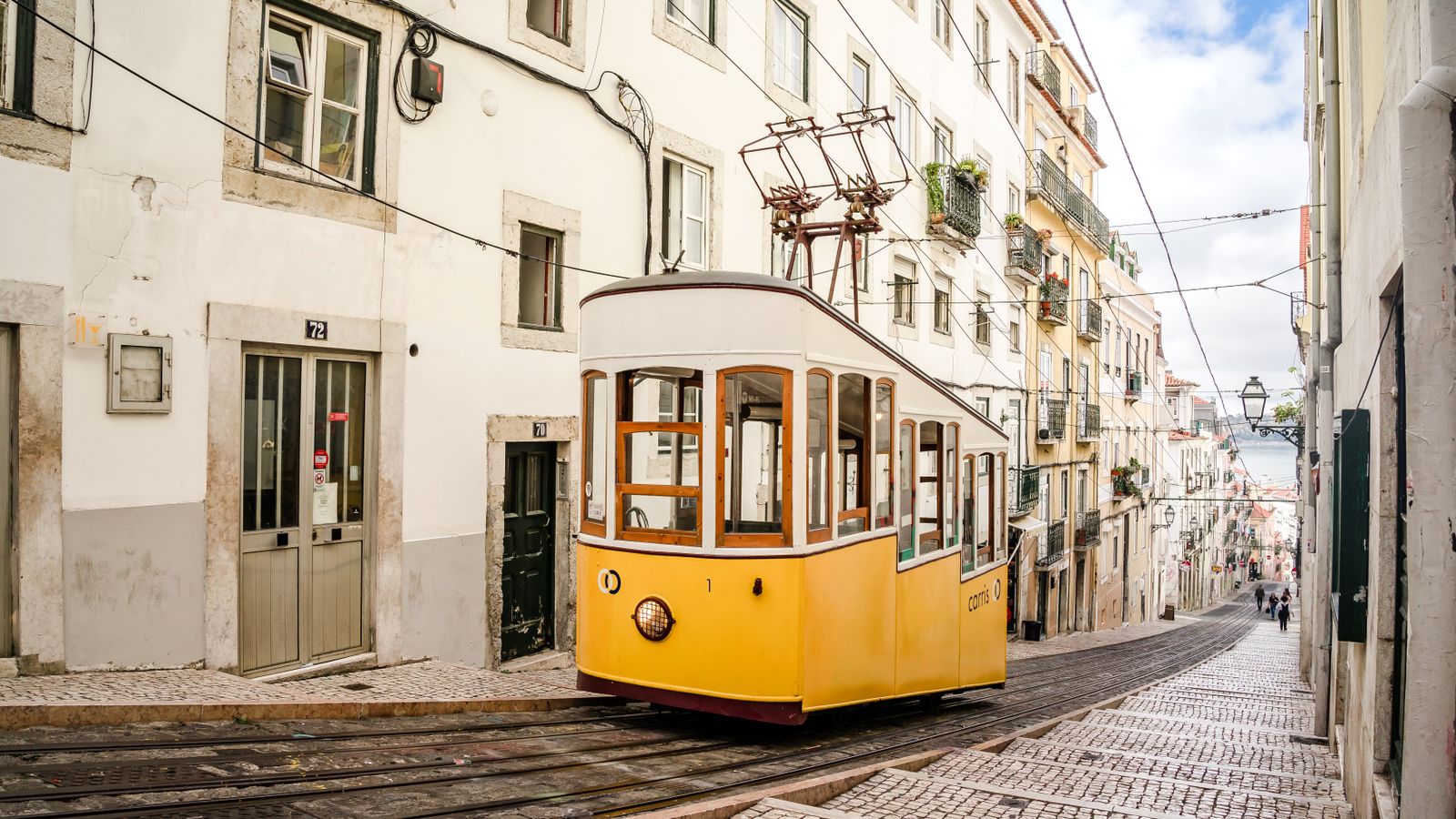 Lisbon's yellow trams climb streets too steep and narrow for anything bigger.