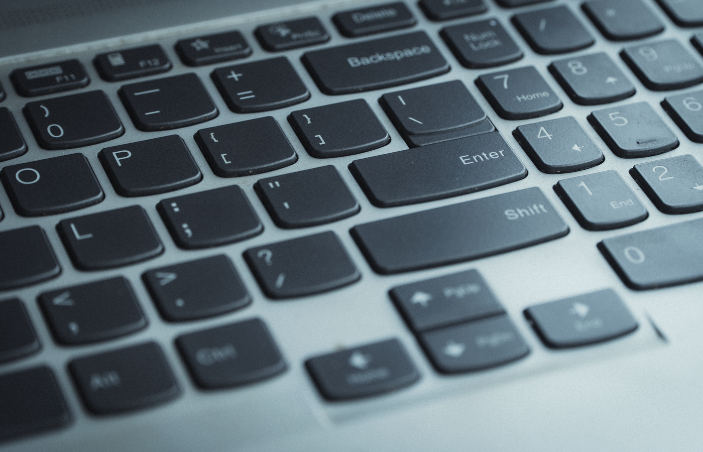 Detailed view of a laptop keyboard with focus on keys. Ideal for tech content.