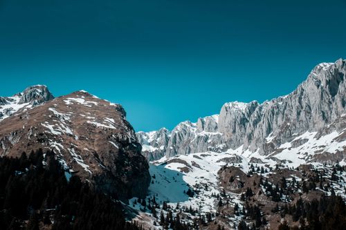 Free Snow-covered peaks of Malga Cassinelli, Italy under a clear blue sky. Scenic winter landscape. Stock Photo