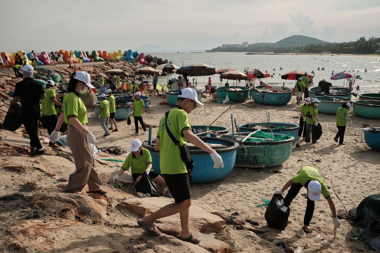 Volunteers working together on a coastal cleanup
