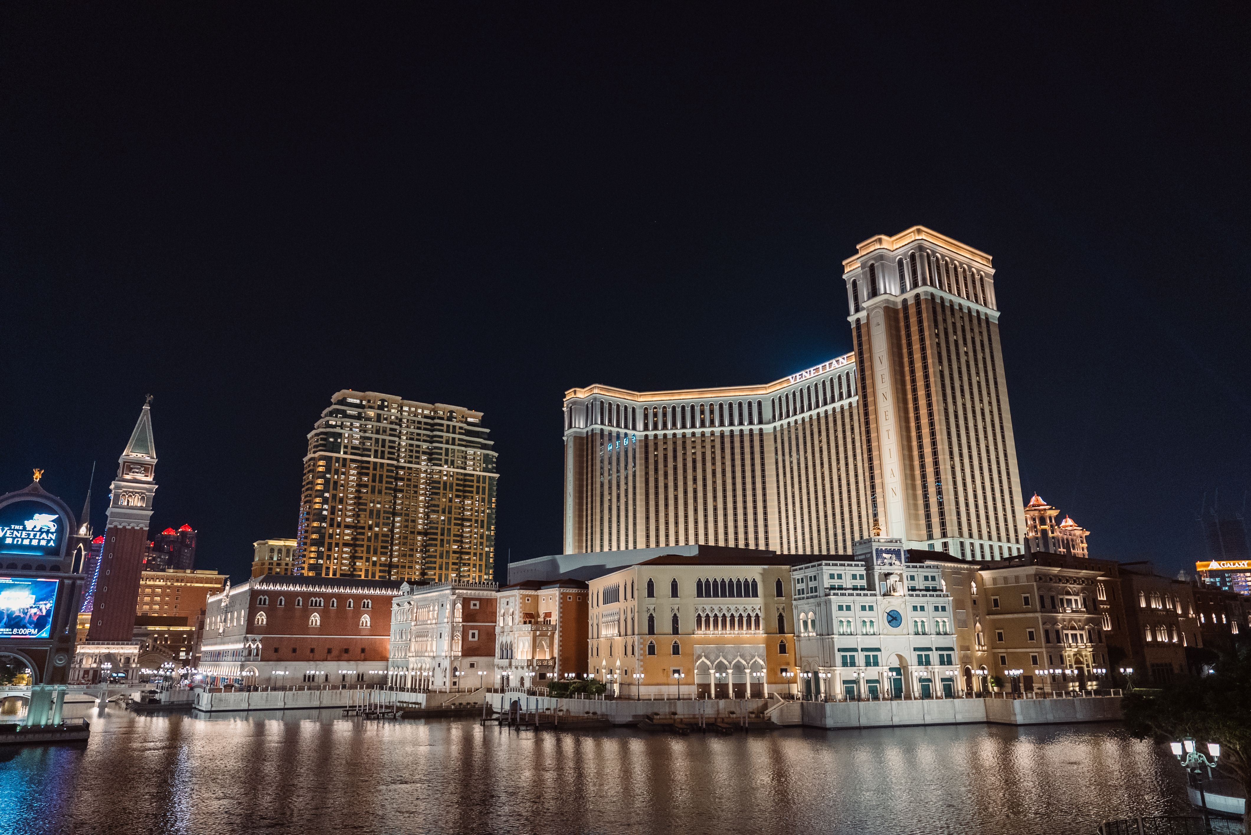 Stunning night view of the Venetian Macao Resort Hotel, beautifully lit against the night sky.