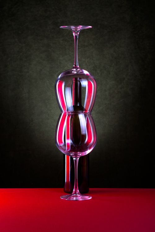 Free Creative display of wine glasses with reflections in a studio setting, perfect for artistic and modern themes. Stock Photo