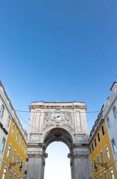 Stunning view of Arco da Rua Augusta under a clear blue sky in Lisbon, Portugal.