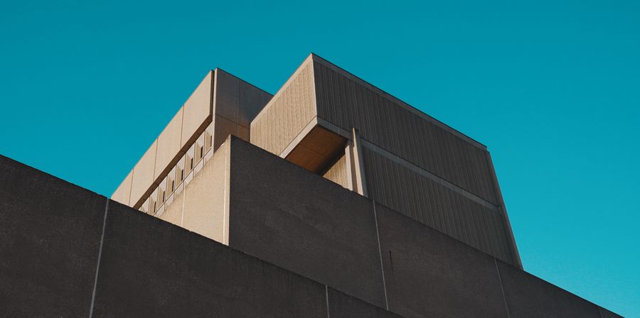 Concrete modernist building against the sky, by d_odd_y on Pexels