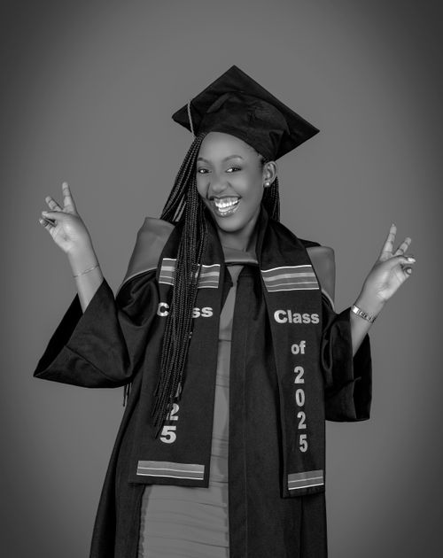 Free Black and white portrait of a joyful graduate from the class of 2025 celebrating achievement. Stock Photo