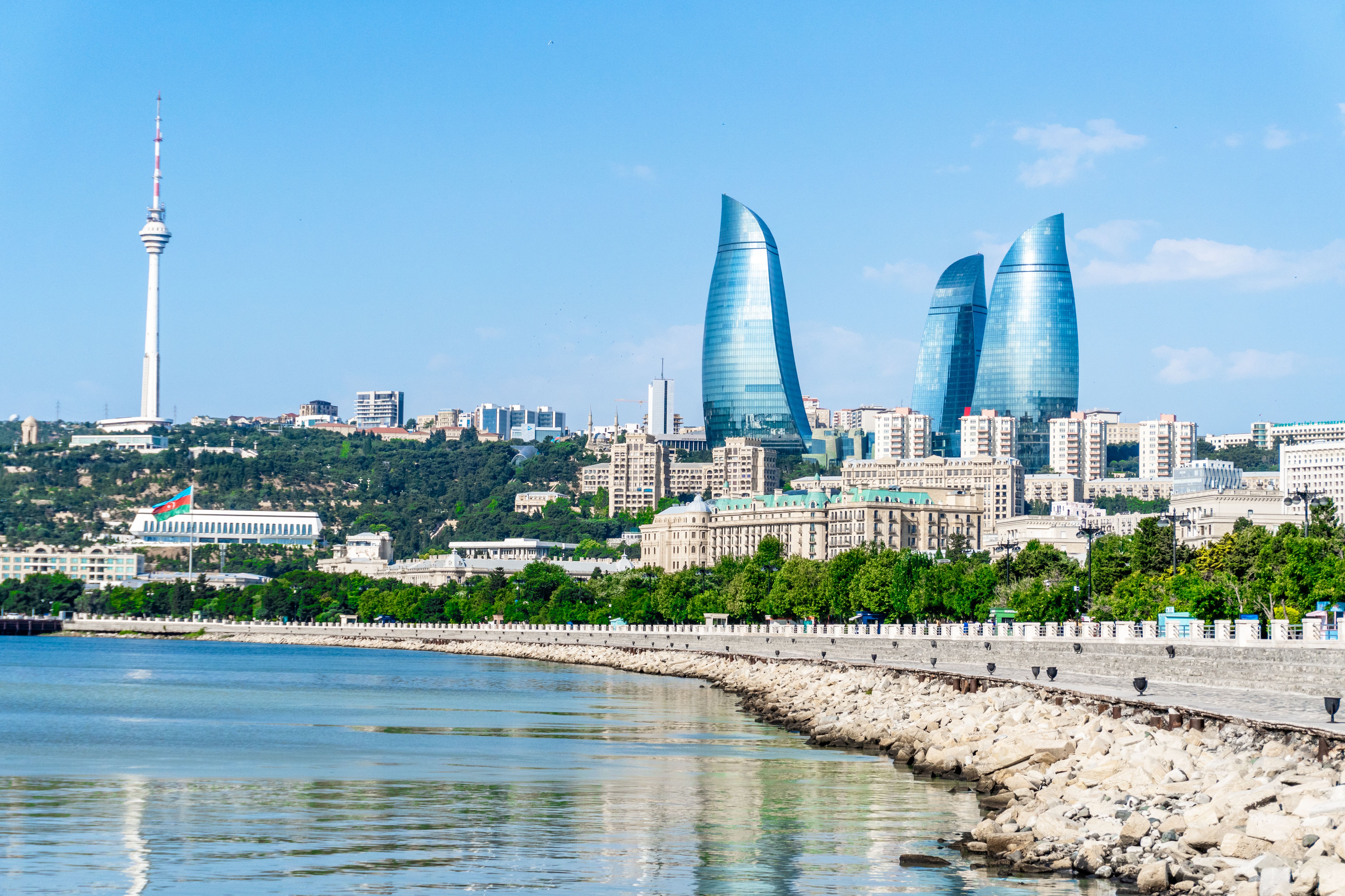 Stunning view of Baku's modern skyline including the iconic Flame Towers and Caspian Sea waterfront.