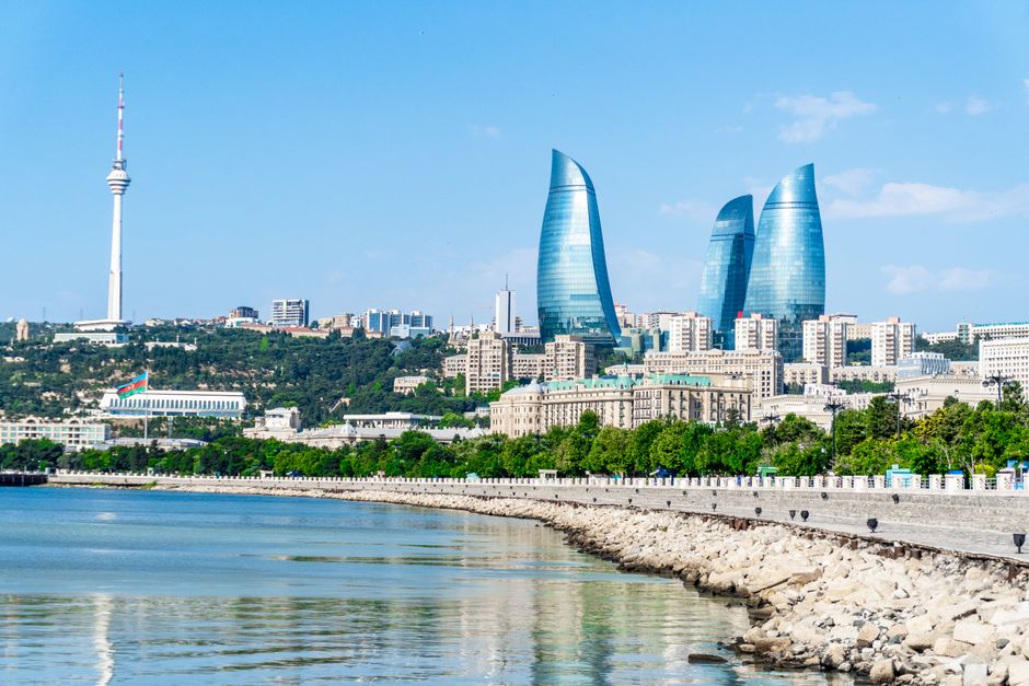 Stunning view of Baku's modern skyline including the iconic Flame Towers and Caspian Sea waterfront.