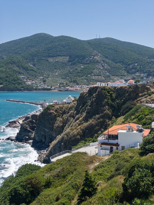 Free Breathtaking view of Skopelos coastline with vibrant blue sea and lush greenery. Stock Photo