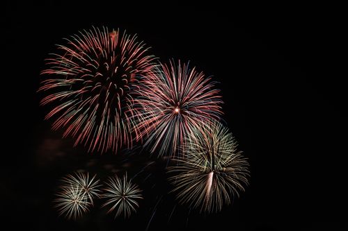 Free A stunning display of colorful fireworks illuminating the night sky. Stock Photo