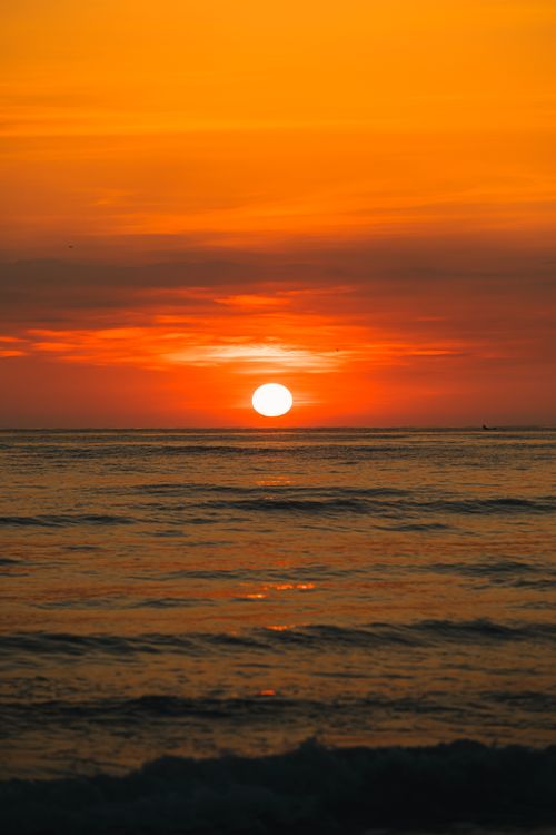 Free Beautiful sunset in Quảng Trị, Vietnam, casting vibrant colors over the ocean horizon. Stock Photo