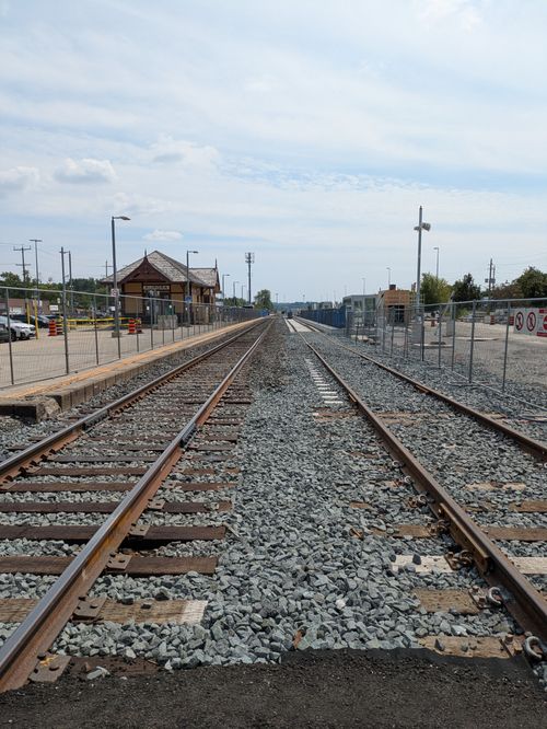 Free View of railway tracks stretching into the distance at a station in Aurora, Canada. Stock Photo